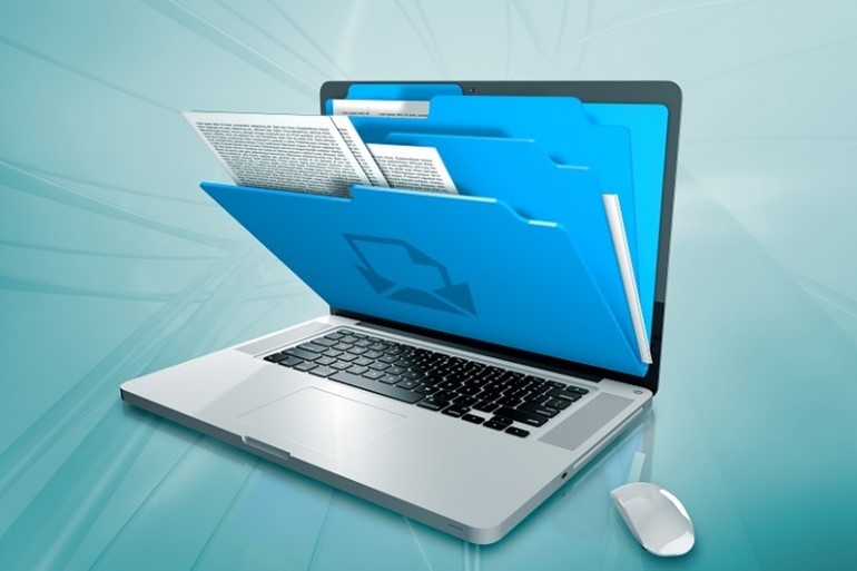 rendering of a laptop with a folder and files coming from the screen of the laptop.